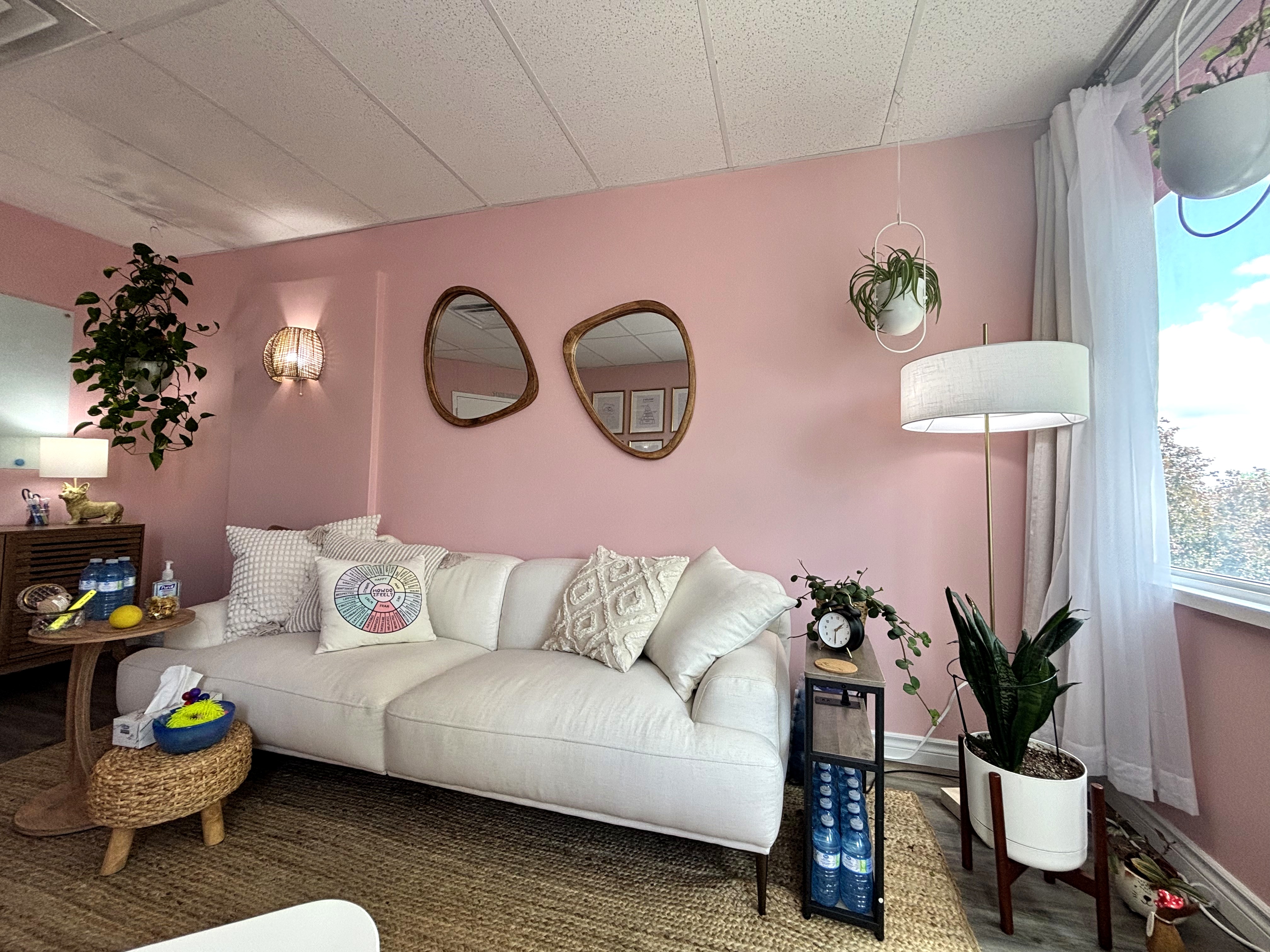 Ontario Therapy office — warm armchair, plants, gallery wall